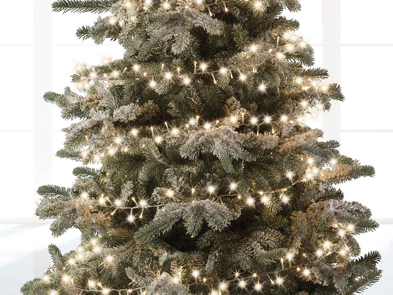 Catena luci 1000led bianco caldo 8 funzioni 22,5mt filo trasparente per uso interno/esterno