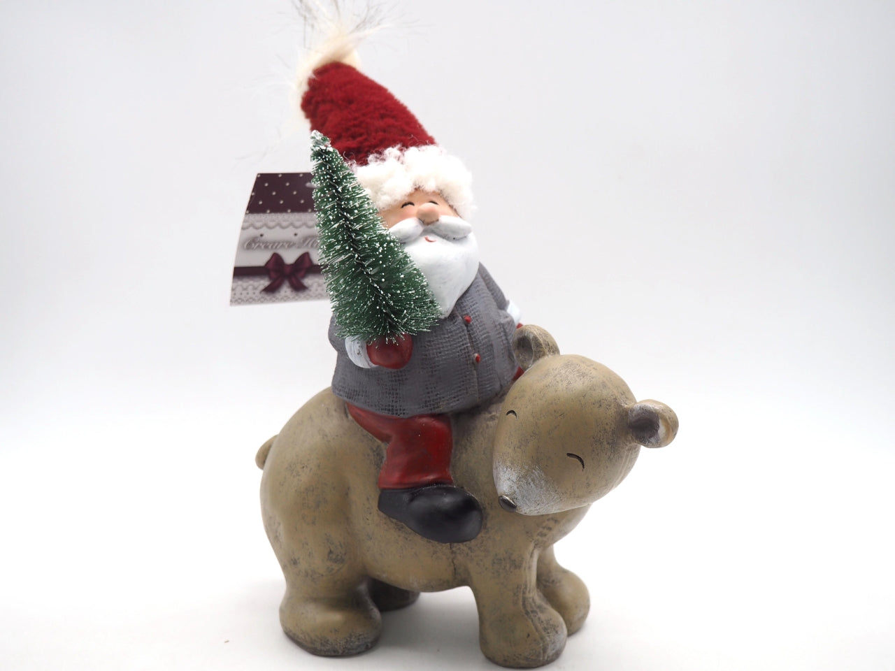Babbo natale su orso in poliresina 20x11xh.28cm