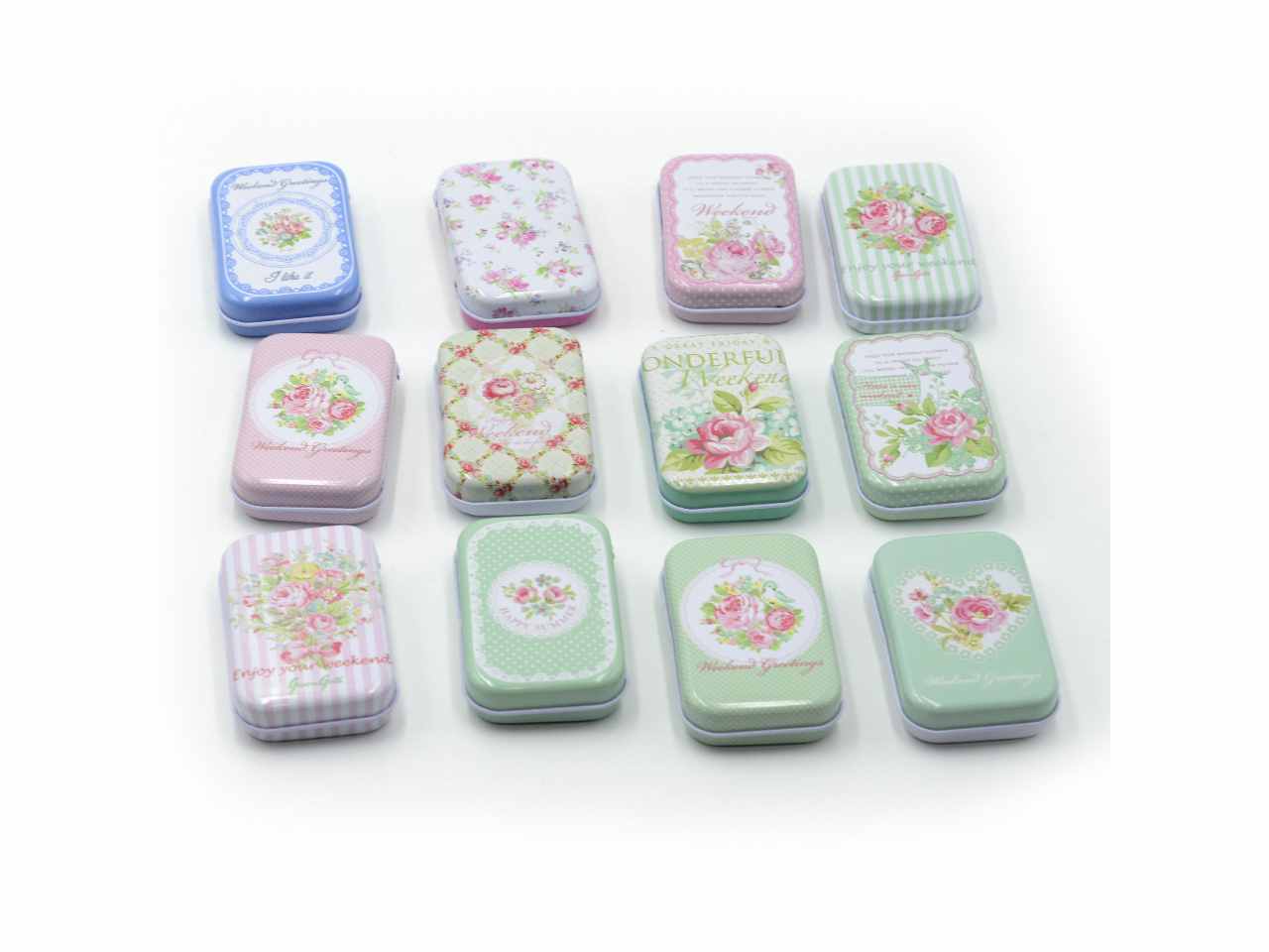 Scatolina in metallo rose 36 pezzi decori assortiti cm7,5x5h2